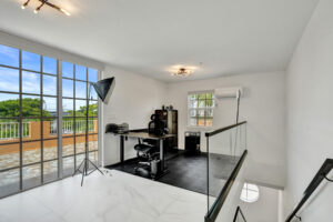 Rooftop office with large glass sliders opening to private terrace in Unit A, 624 NE 29th Drive.