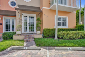 Front entry of Unit A with French doors and tropical landscaping at 624 NE 29th Drive, Wilton Manors.