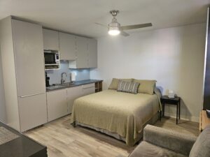 Furnished studio bedroom with queen bed Lauderdale Tennis Club