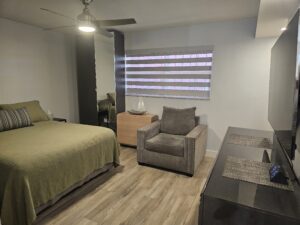 Furnished studio bedroom sitting area Lauderdale Tennis Club