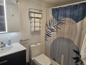 Modern bathroom with shower and vanity studio rental