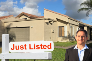 Just Listed lakefront villa for sale at 566 Village Lake Drive in Weston, Florida featuring 3 bedrooms, 2 bathrooms, a 2-car garage, and beautiful water views. Listed by Scott Rivelli.